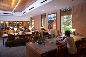 Students study at tables in the law library.