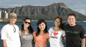 Five students—2 male, 3 female—pose in view of Diamond Head, a volcanic crater.