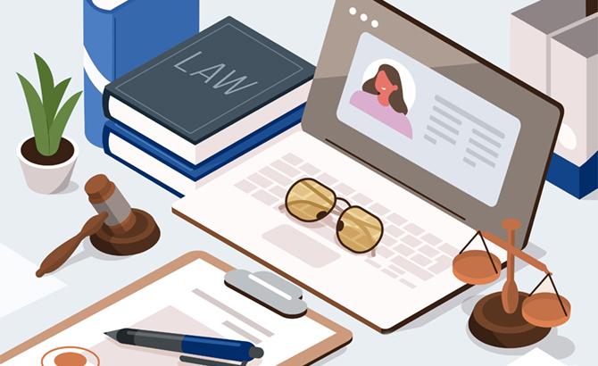 illustration of an open laptop on a desk, surrounded by scales, a gavel, and a law textbook