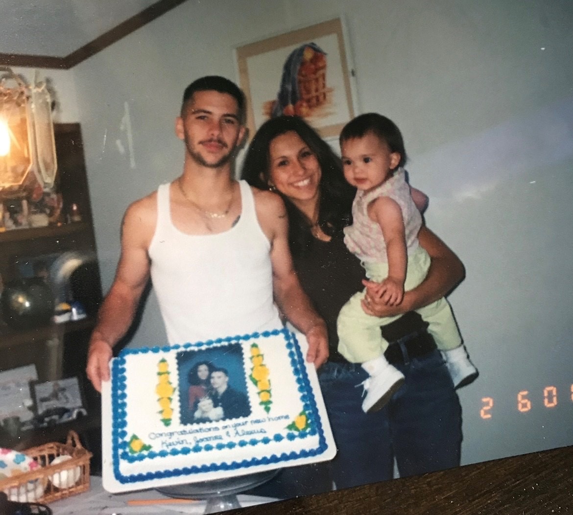 Alexus and her parents on her 1st or 2nd birthday. 