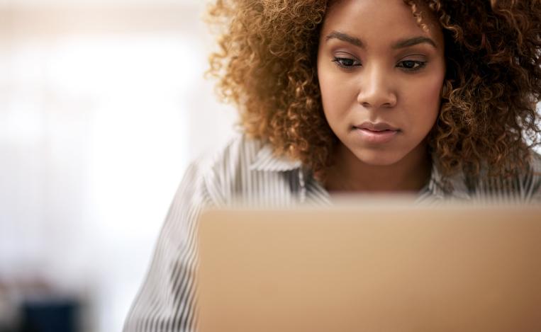 woman concentrating at a computer