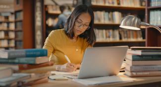 Law student at laptop studying