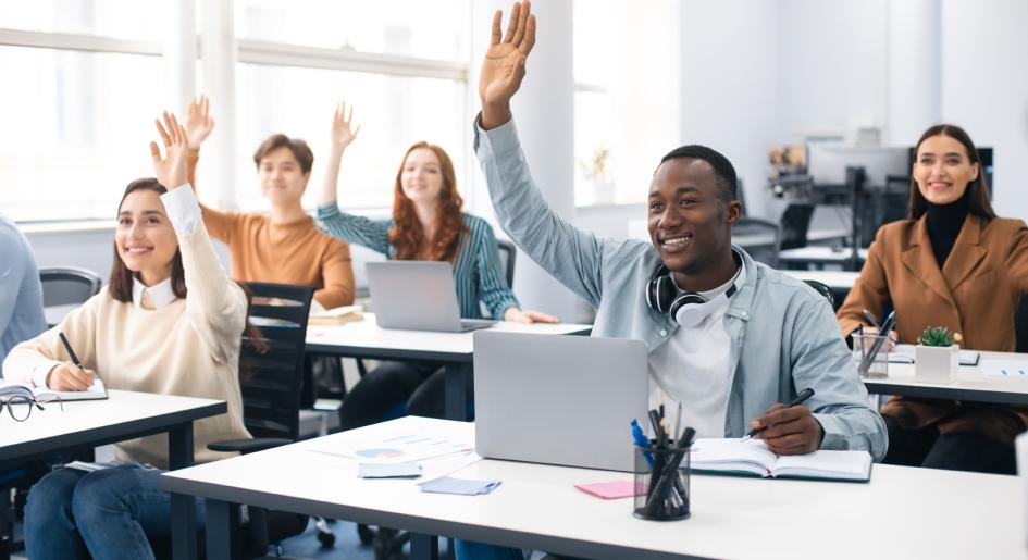 Law students in class, with one student raising their hand