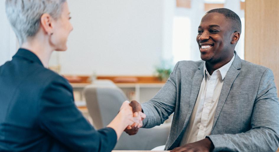 Law school graduate shaking hands with potential employer