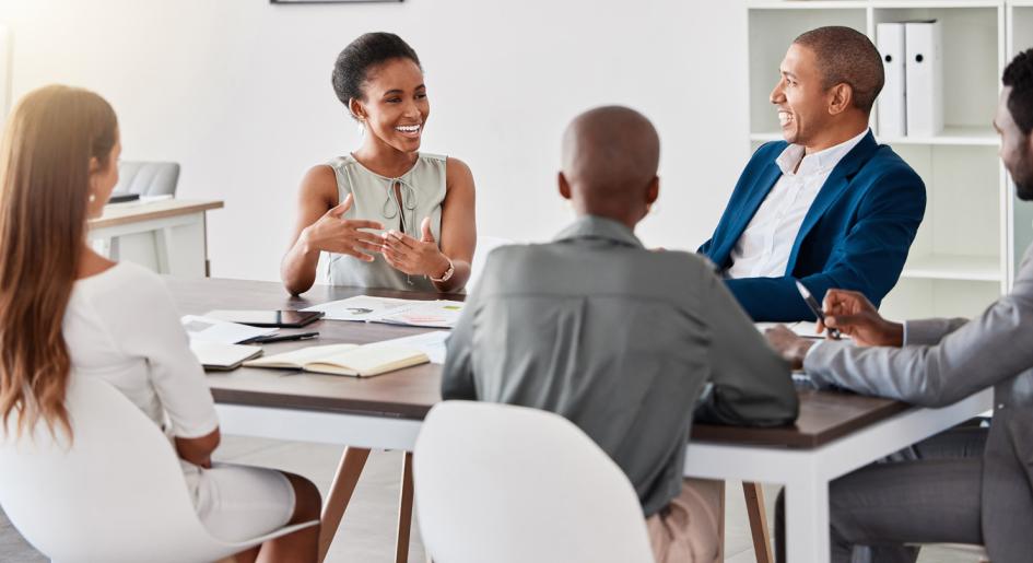 Group of legal professionals conversing at a table