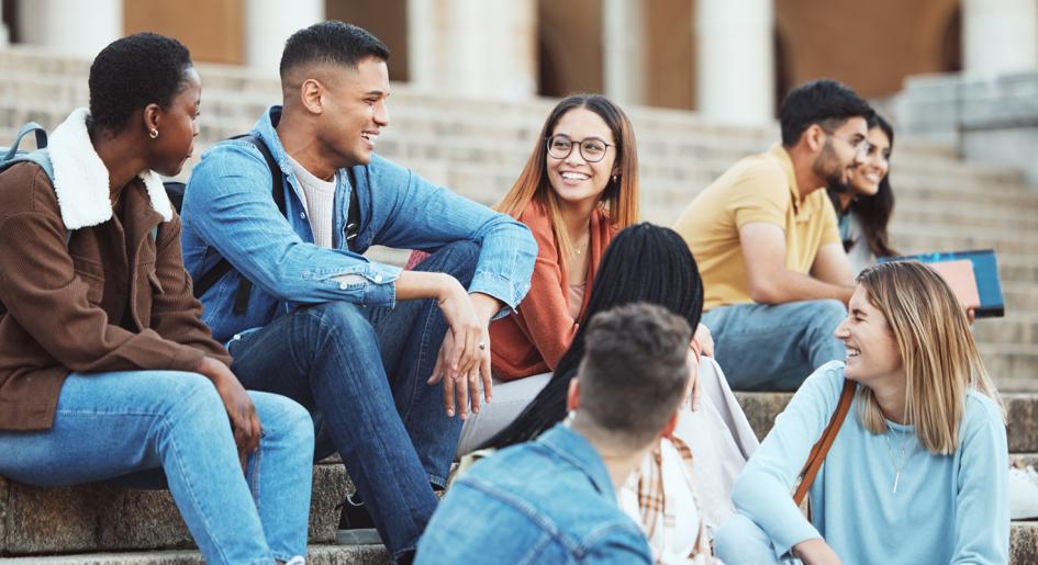 diverse law students gathered on steps socializing