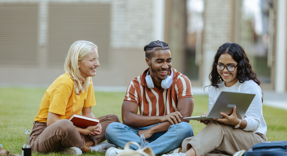 Diverse law students sitting on blanket outside