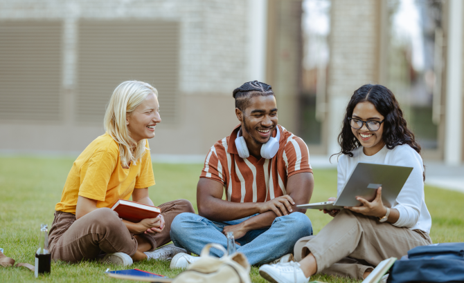 Diverse law students sitting on blanket outside